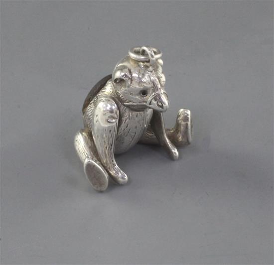 An Edwardian novelty silver pin cushion, modelled as a bear with articulated limbs, H.V. Pithey & Co, 44mm.